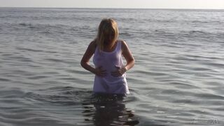 Divine Blonde Teen Blissfully Naked in the Sea