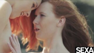Watch these two hot redheads have wild lesbian sex on the beach