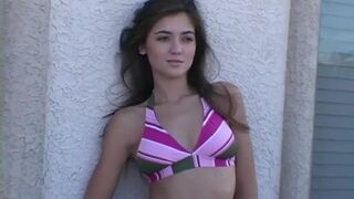 Stripping teen babe takes off her bikini